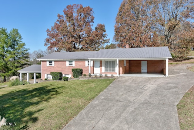 single story home featuring a front lawn and a carport