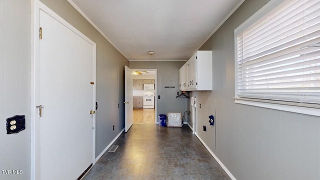 laundry room with crown molding