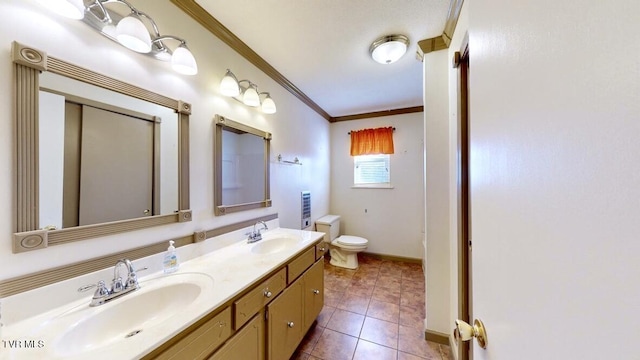 bathroom with crown molding, tile patterned flooring, vanity, and toilet