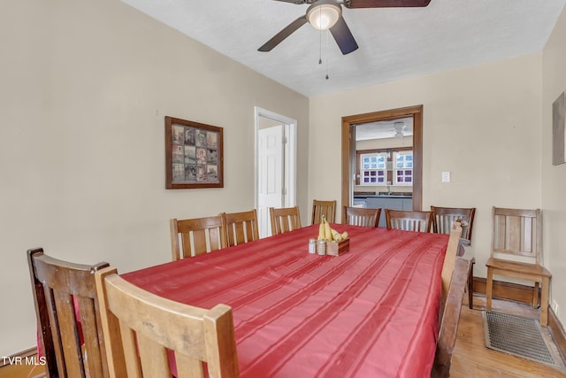 106 W Sycamore Ave, Big Stone Gap, VA 24219 - dining space featuring wood finished floors, ceiling fan, and baseboards