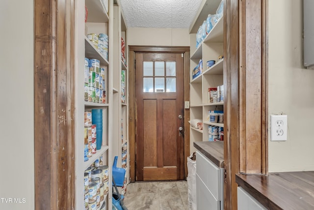 106 W Sycamore Ave, Big Stone Gap, VA 24219 - doorway to outside with a textured ceiling