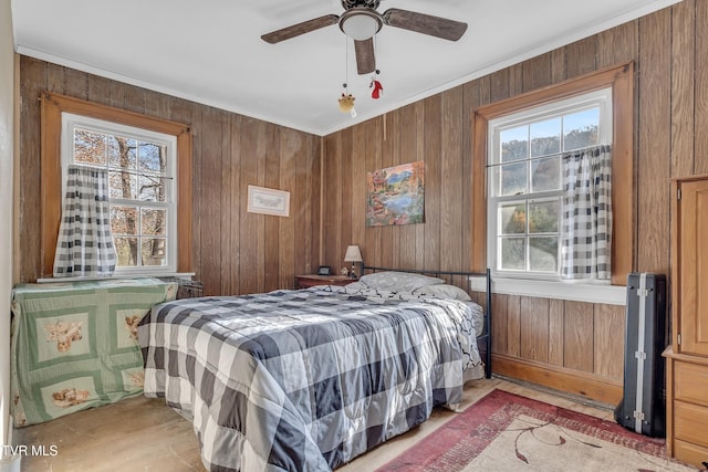 106 W Sycamore Ave, Big Stone Gap, VA 24219 - bedroom with wood walls, crown molding, and ceiling fan