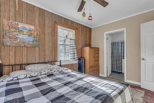 106 W Sycamore Ave, Big Stone Gap, VA 24219 - bedroom with ornamental molding, baseboards, wooden walls, ensuite bath, and ceiling fan