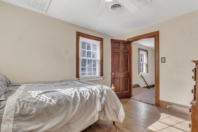 106 W Sycamore Ave, Big Stone Gap, VA 24219 - bedroom featuring wood finished floors, ceiling fan, and baseboards