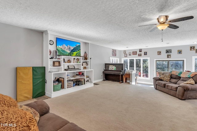 106 W Sycamore Ave, Big Stone Gap, VA 24219 - living area featuring ceiling fan, a textured ceiling, carpet flooring, and baseboards