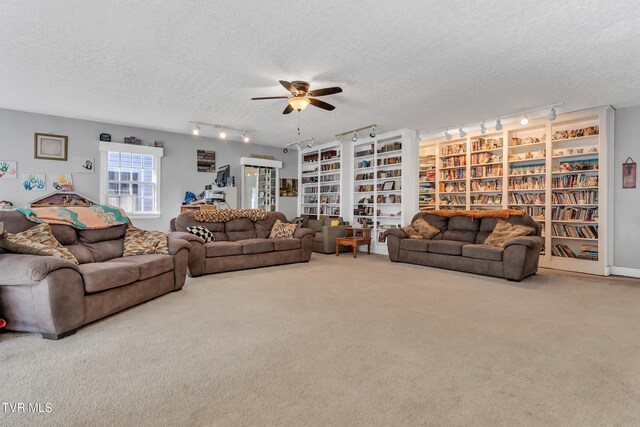 106 W Sycamore Ave, Big Stone Gap, VA 24219 - living room featuring rail lighting, a textured ceiling, ceiling fan, and carpet flooring