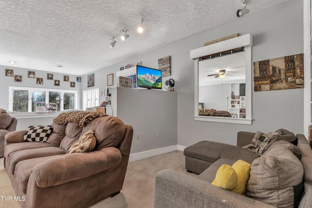 106 W Sycamore Ave, Big Stone Gap, VA 24219 - living room featuring light carpet, a textured ceiling, a ceiling fan, and track lighting