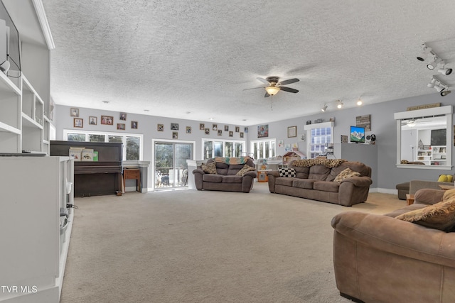 106 W Sycamore Ave, Big Stone Gap, VA 24219 - living area featuring ceiling fan, light colored carpet, a textured ceiling, and track lighting