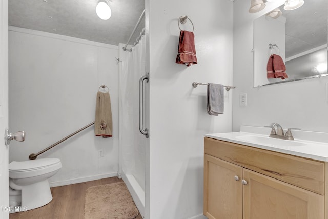 106 W Sycamore Ave, Big Stone Gap, VA 24219 - bathroom with wood finished floors, vanity, toilet, curtained shower, and baseboards
