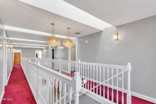 106 W Sycamore Ave, Big Stone Gap, VA 24219 - hall with carpet, an upstairs landing, a chandelier, and baseboards