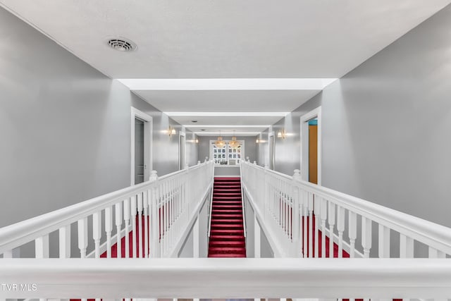 106 W Sycamore Ave, Big Stone Gap, VA 24219 - corridor with an upstairs landing and a chandelier