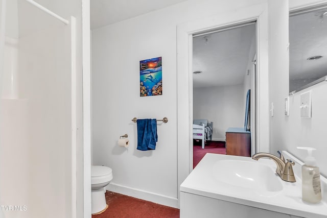 106 W Sycamore Ave, Big Stone Gap, VA 24219 - ensuite bathroom with vanity, toilet, and baseboards