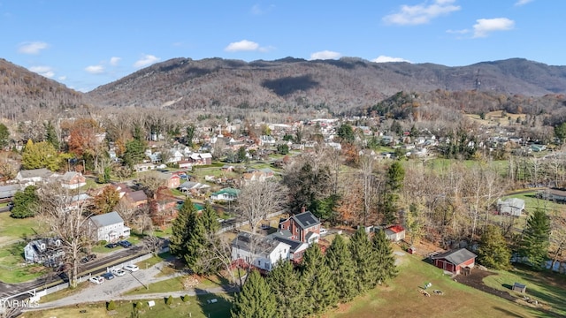 106 W Sycamore Ave, Big Stone Gap, VA 24219 - aerial overview of property's location with a mountain backdrop and nearby suburban area