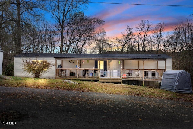 view of front of property featuring a wooden deck