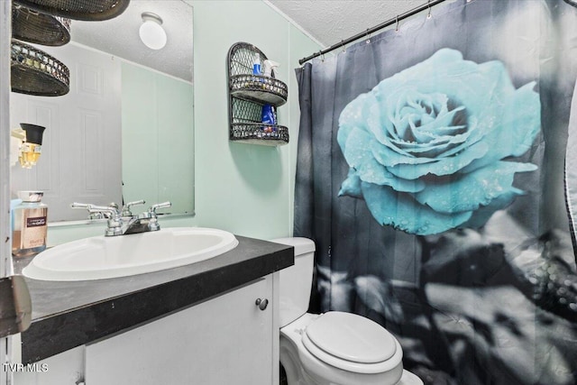 bathroom featuring vanity, a shower with curtain, a textured ceiling, and toilet