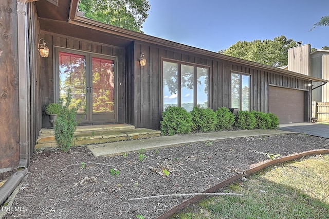 doorway to property featuring a garage