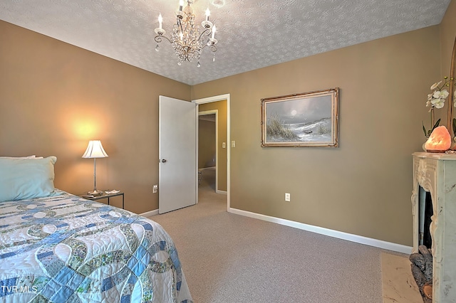 bedroom with light carpet, a textured ceiling, and a chandelier