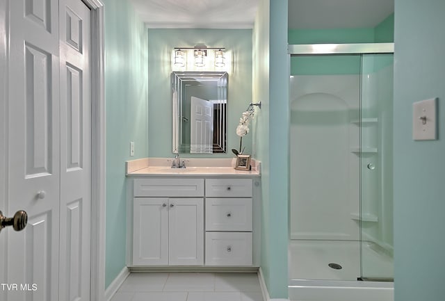 bathroom featuring tile patterned flooring, vanity, and an enclosed shower