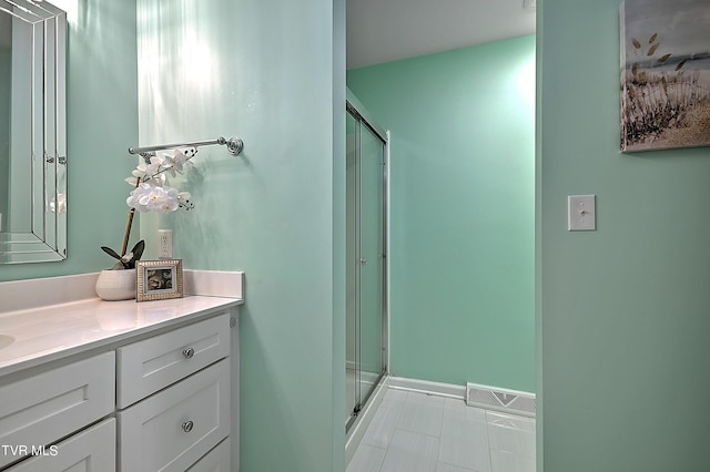 bathroom featuring vanity and walk in shower