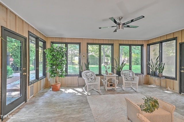 sunroom / solarium with ceiling fan