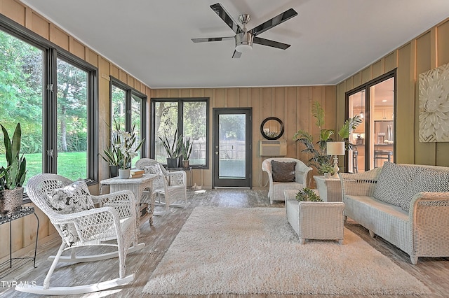 sunroom featuring ceiling fan