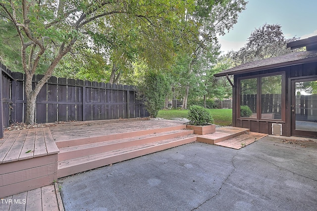 wooden deck with a patio area