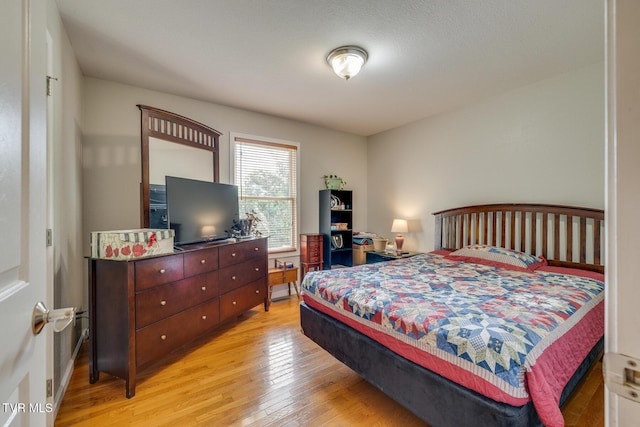 bedroom with light wood-style floors