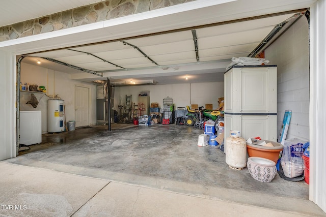 garage with concrete block wall and water heater