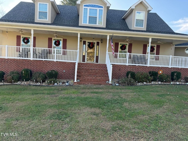 view of front of house with a porch and a front yard