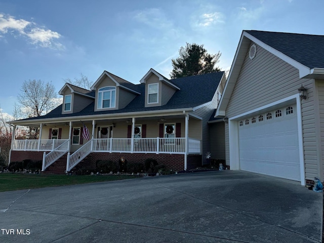 view of front of house with a porch and a garage