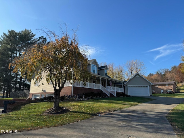 view of front of property with a front yard, a porch, and a garage