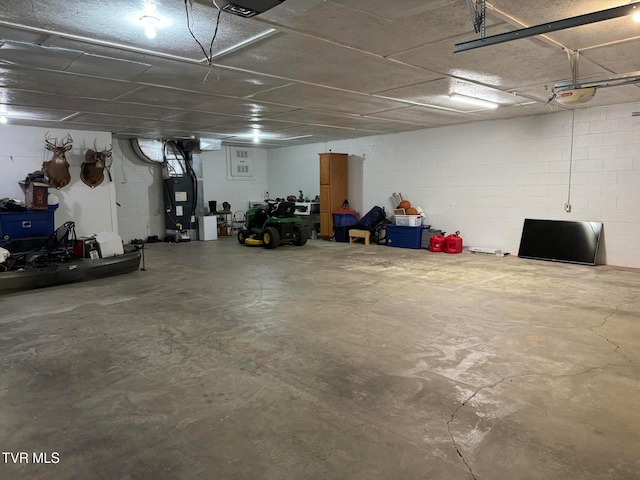 garage with a garage door opener and heating unit