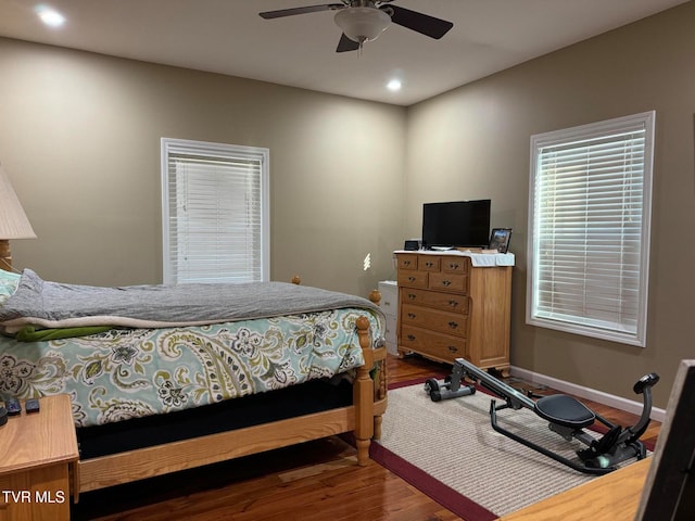 bedroom featuring wood-type flooring and ceiling fan