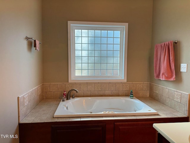 bathroom featuring vanity and a tub