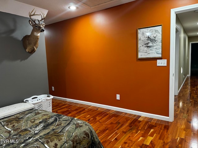 bedroom with hardwood / wood-style flooring