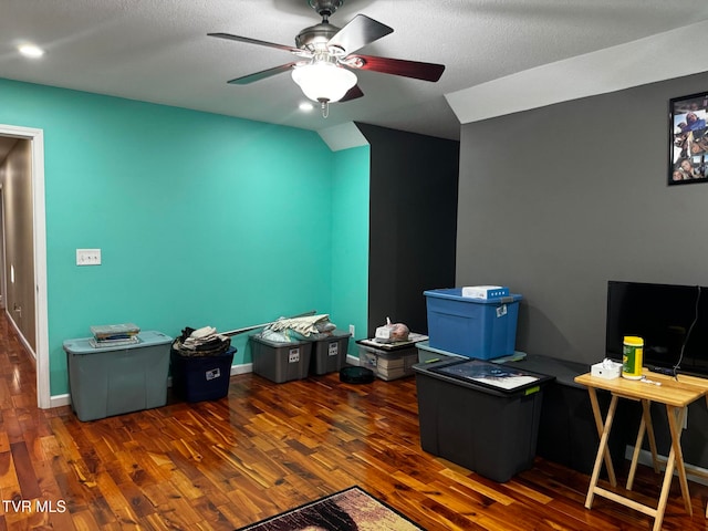 office with dark hardwood / wood-style floors, ceiling fan, and a textured ceiling