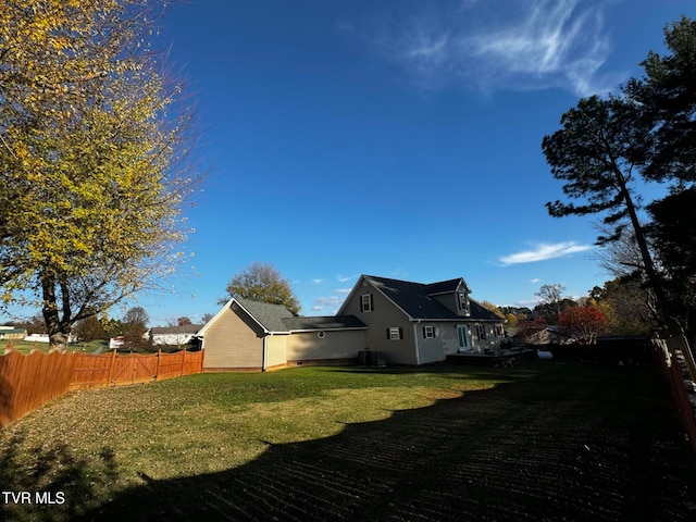 view of property exterior with a yard