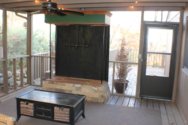 entryway featuring plenty of natural light and ceiling fan