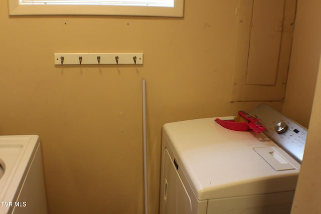 clothes washing area with washing machine and dryer