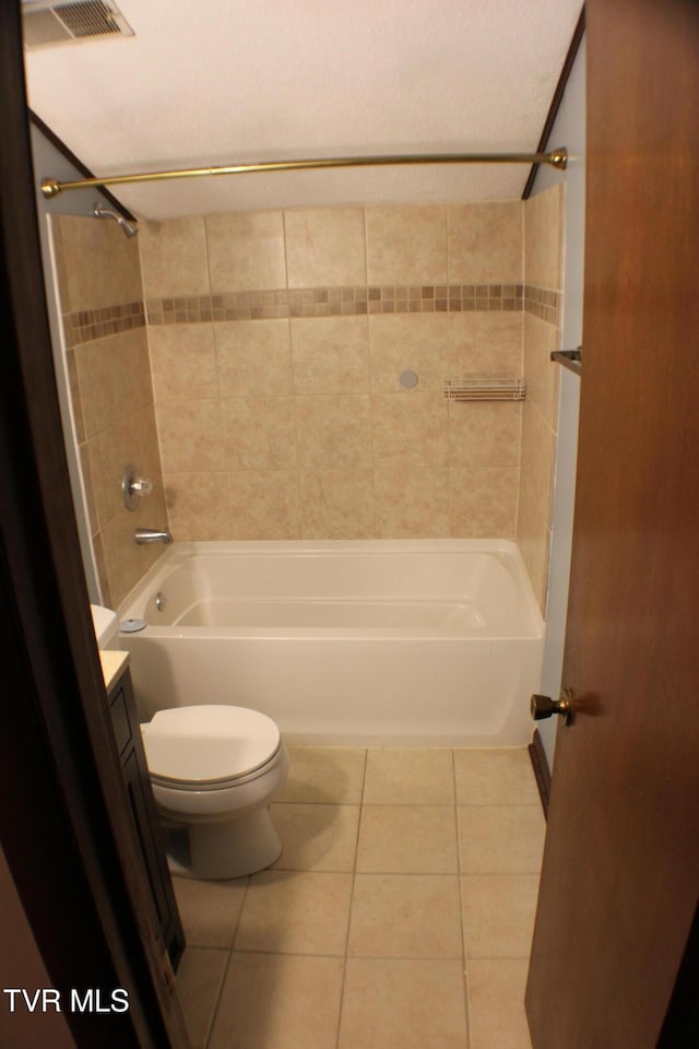 full bathroom with tile patterned floors, vanity, toilet, and tiled shower / bath