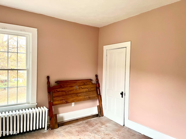 bedroom featuring radiator heating unit