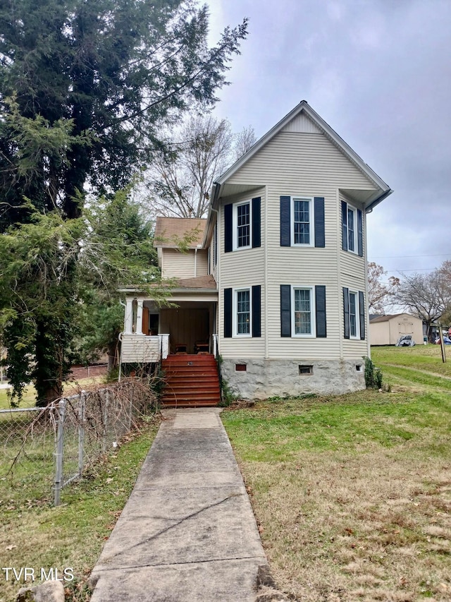 view of front facade with a front lawn and a porch