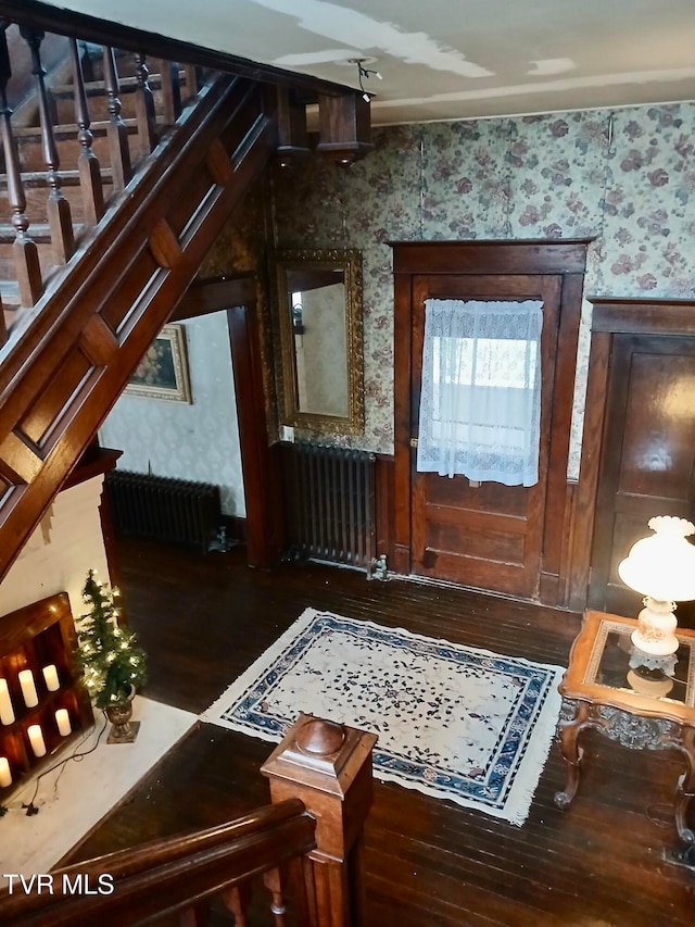 interior space featuring radiator and wood-type flooring