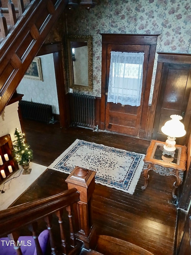 interior space featuring dark hardwood / wood-style floors and radiator heating unit