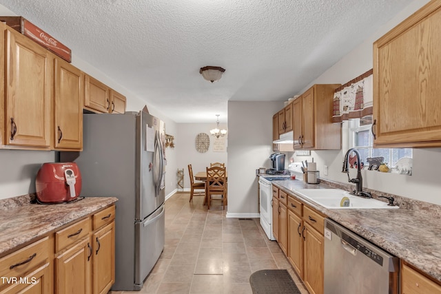 kitchen with sink, hanging light fixtures, stainless steel appliances, an inviting chandelier, and light tile patterned floors