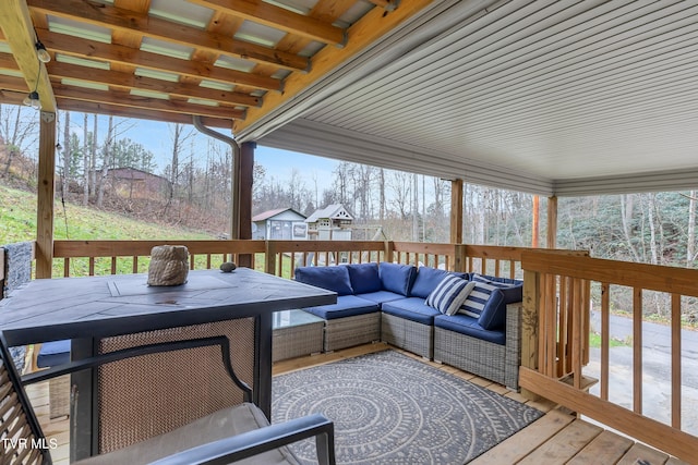 wooden terrace with outdoor lounge area