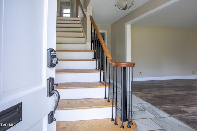 staircase featuring hardwood / wood-style floors