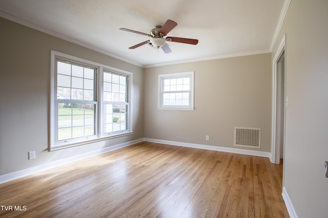 spare room with ceiling fan, crown molding, and light hardwood / wood-style flooring