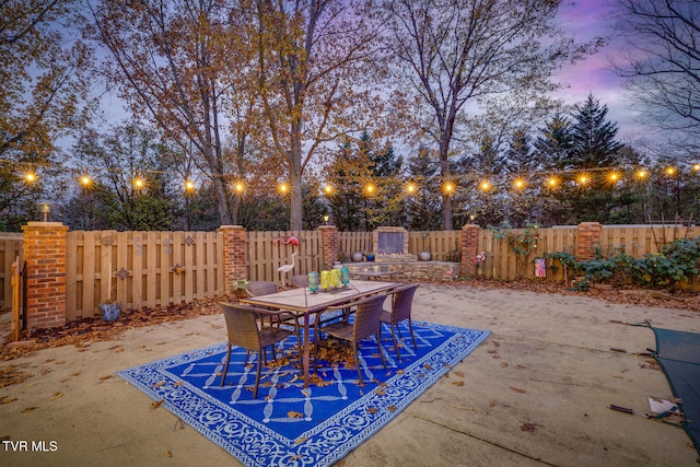 view of patio terrace at dusk