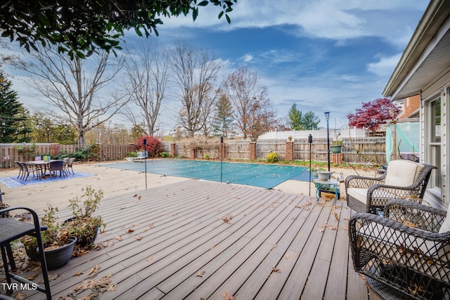 view of swimming pool with a wooden deck